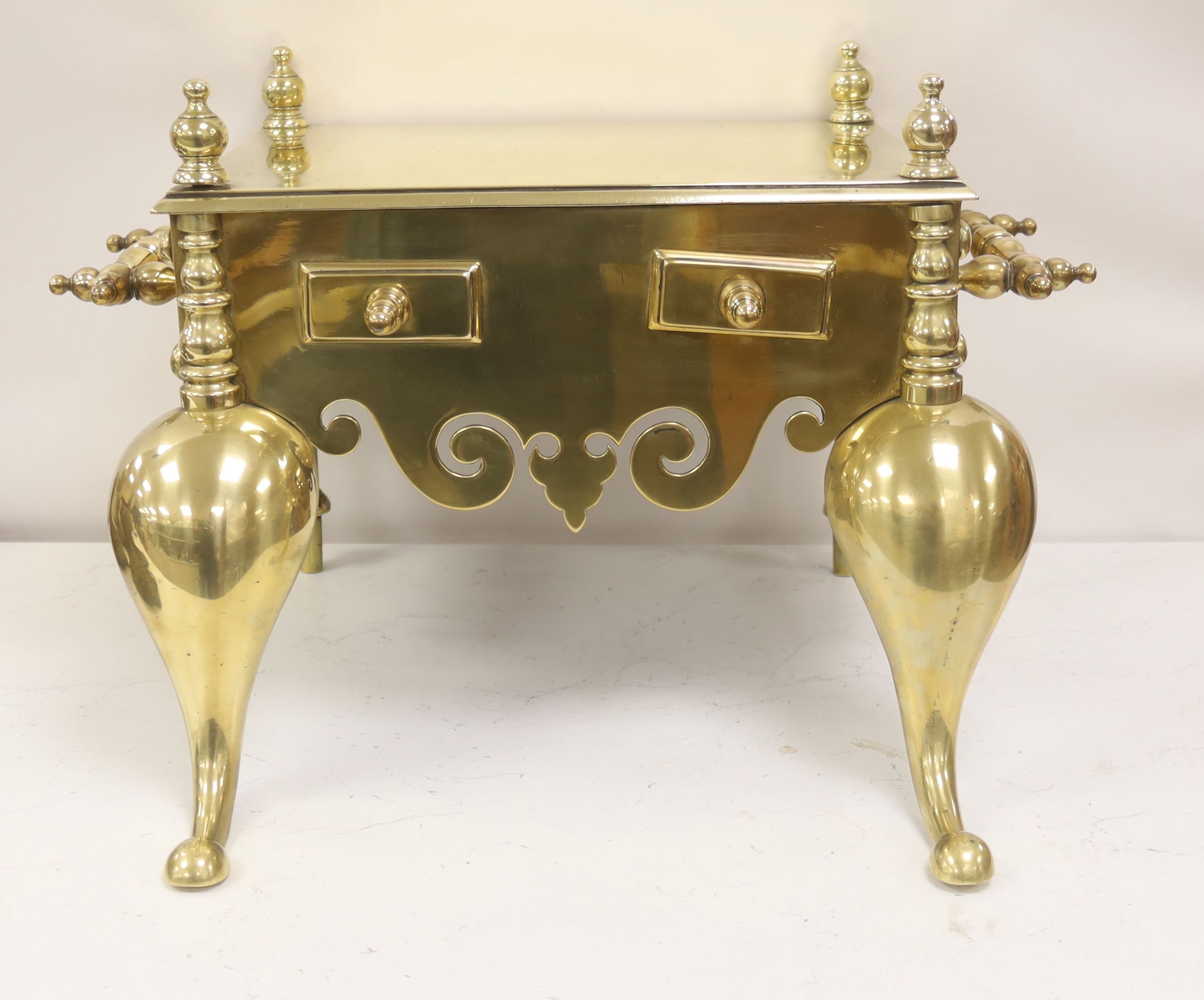 A Georgian brass footman, 55cm wide
